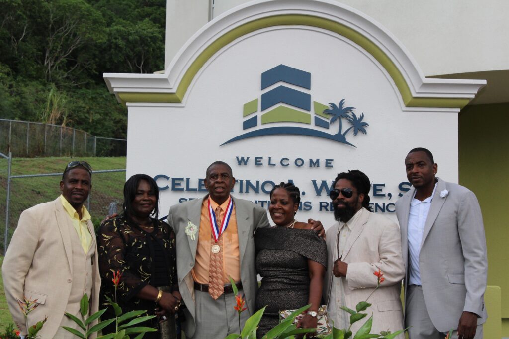 Celestino property with team in front of the sign